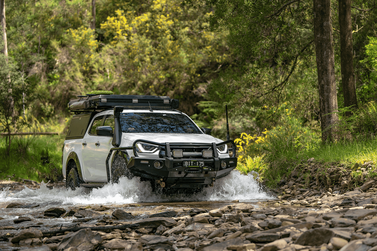 Ironman 4x4 Frontier Winch with synthetic rope winch being used with recovery ring in a double line winch pull to recover a Nissan Navara from a bog hole.